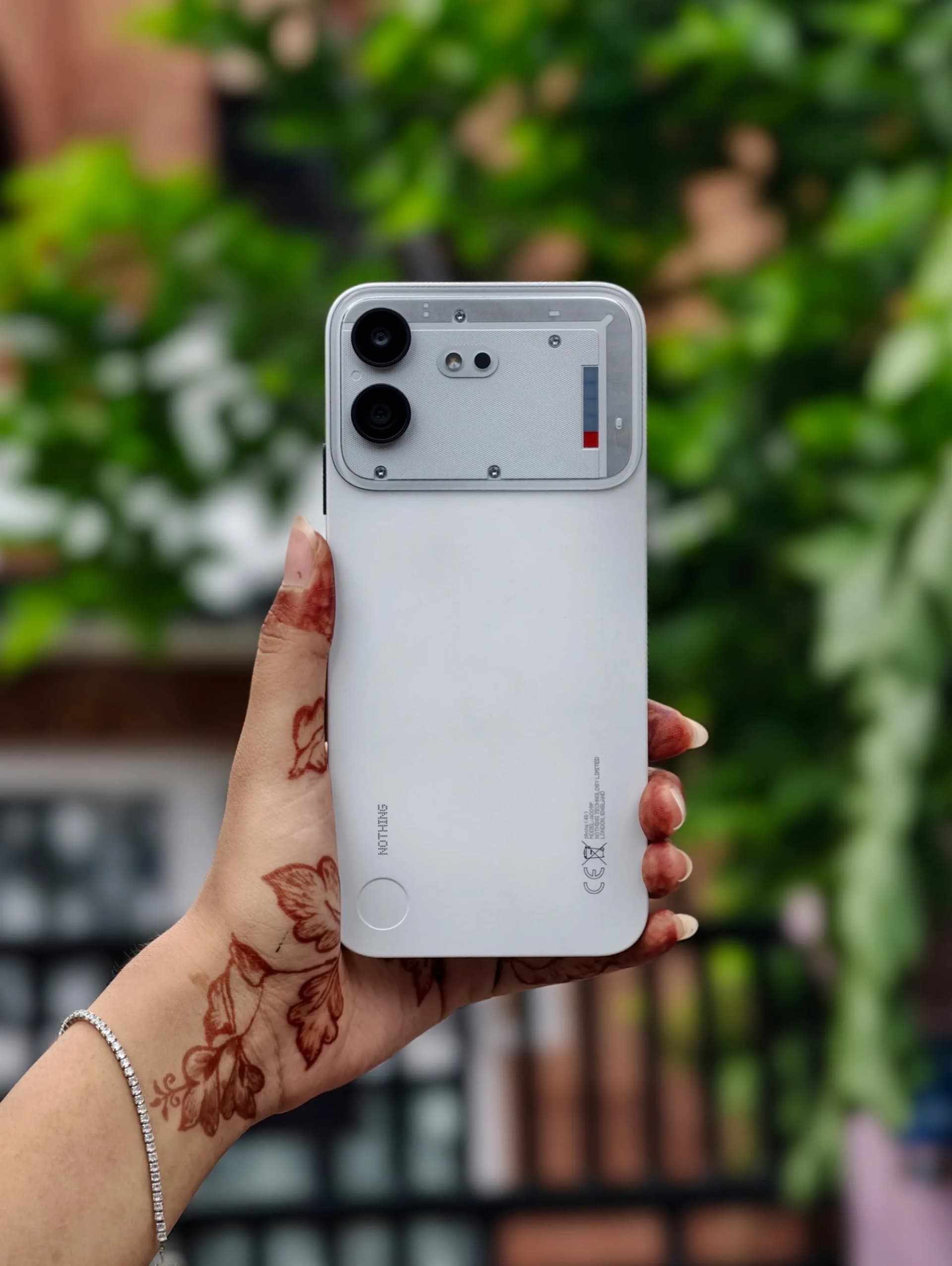 mobile being held and back looks of white nothing phone 4b